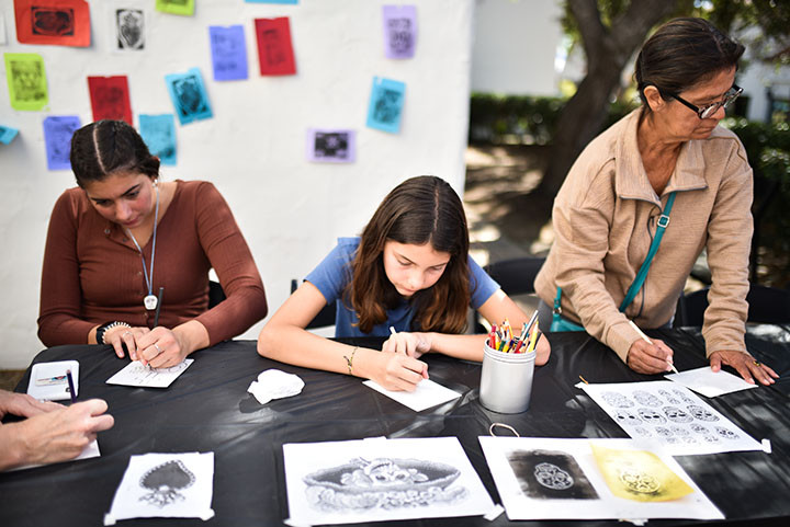 Kids and adults create Día de los Muertos-inspired artwork together